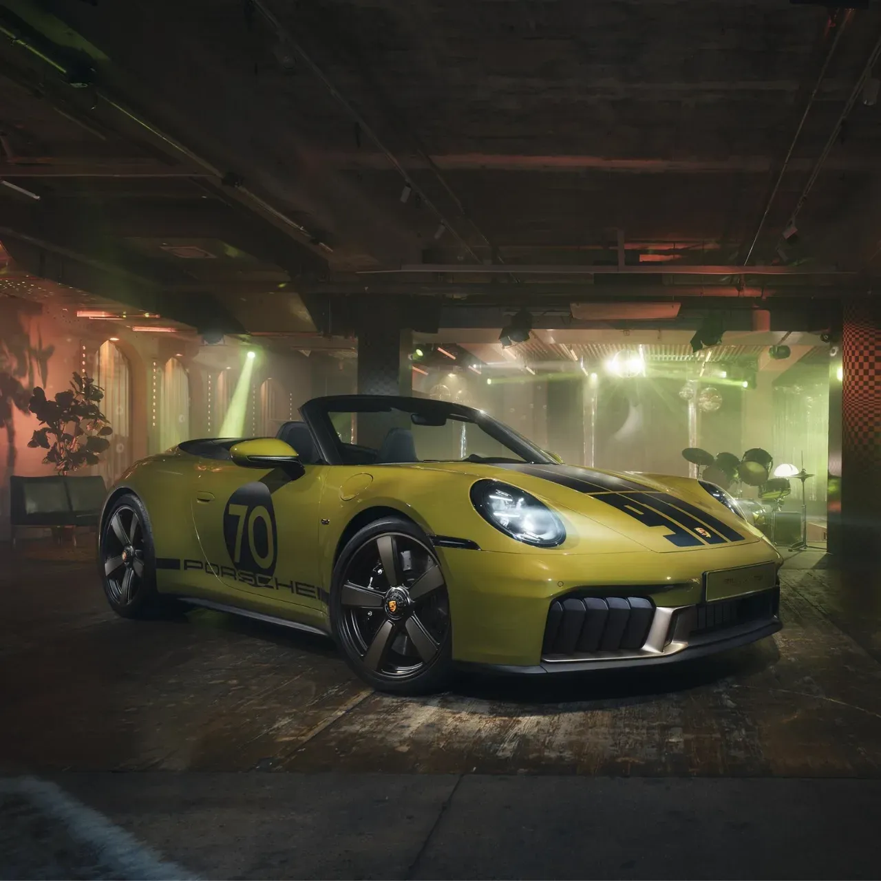 FULL-BLEED — supercar three-quarter, wet reflection, dusk